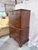 A stately Henkel Harris chest on chest crafted in richly figured solid mahogany with timeless Chippendale-inspired styling...