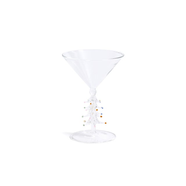 Serve holiday spirits with a playful twist using this set of four martini glasses, each featuring a festive tree stem...