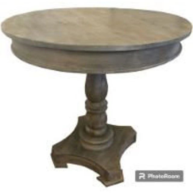 This rustic round parlor lamp table is crafted from solid wood with a chunky base, perfect as an accent table....