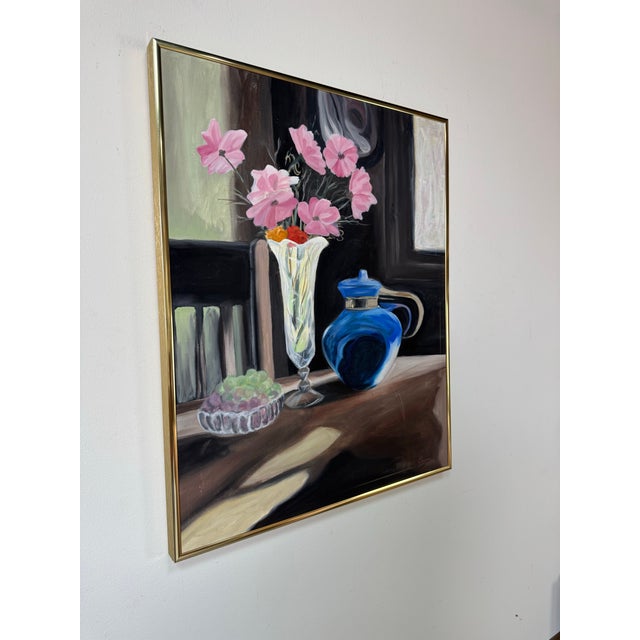 A charming vintage still life oil on canvas painting by Eric Lewis, beautifully framed in a sleek gold-tone aluminum...