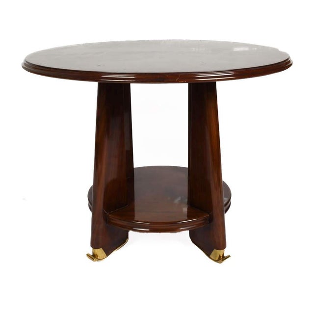 Elegant and architecturally composed, this pair of French Art Deco-style side tables captures the streamlined...