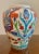 Beautifully handprinted Turkish urn with stylized flowers. Vibrant colors will brighten up a shelf. Place by your door to...