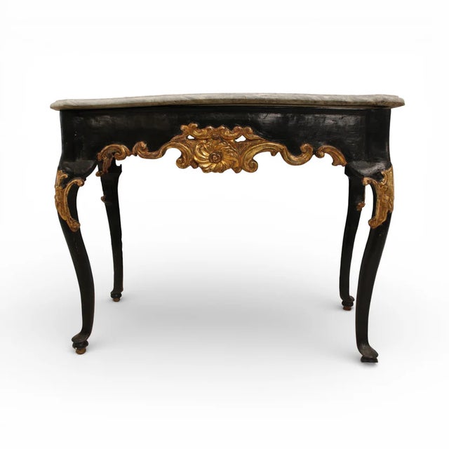 An elegant example of 18th-century Italian craftsmanship, this antique console table showcases timeless sophistication and...