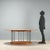 Oval table from the 1980s-1990s with an elegant top and a walnut wood base, perfect for those seeking furniture that...