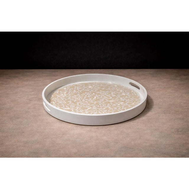 Executed in the historic maque lacquer tradition of Olinalá, Guerrero, this circular tray reflects a lineage of Mexican...