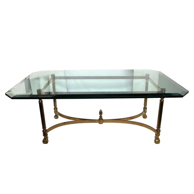 A vintage coffee table with a glass top. A wonderful addition to your living space. Minimal wear to the glass.