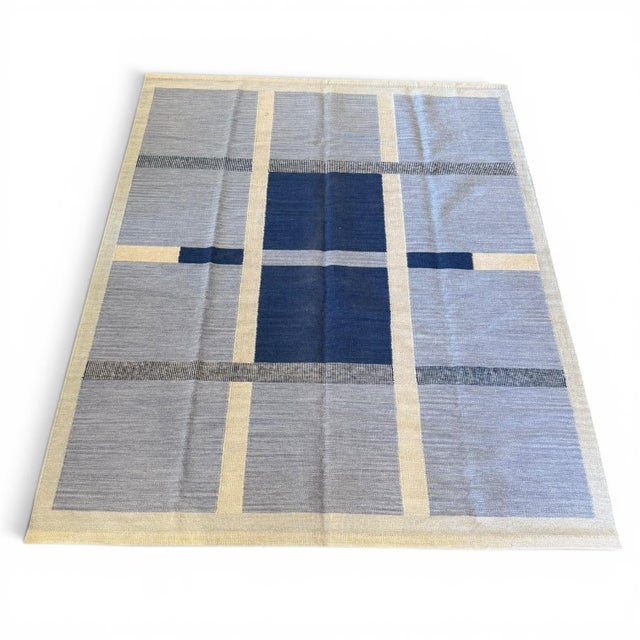 A striking balance of geometry and restraint, this Swedish-inspired kilim rug offers a refined interpretation of...