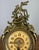 This Vintage French brass mantel clock is a richly ornate decorative piece, featuring elaborate scrolling forms and...