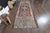 Vintage Hand-Knotted runner rug is a semi-antique vintage area rug. The '70s Eastern region of Anatolia's unique rug is...