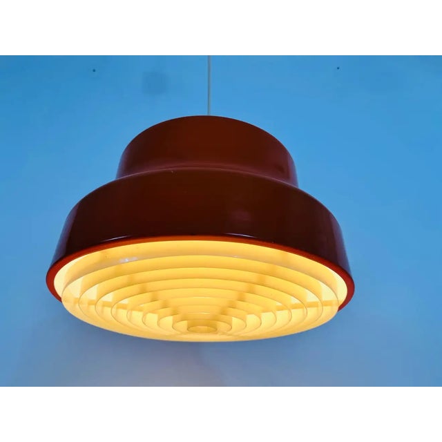 Plastic Bumling pendant lamp made in the 1970s. Measures: Height of shade: 21 cm Max height: 90 cm Diameter: 36 cm The...