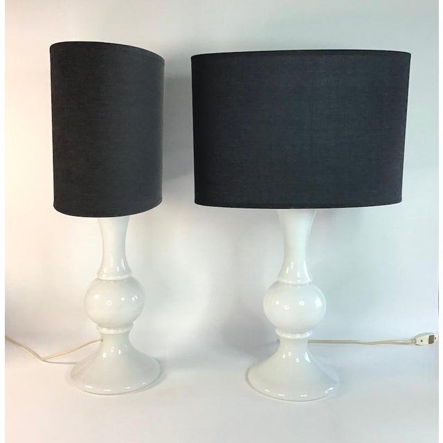 Sculptural table lamps that celebrate the transparency and fluid forms of 1960s Swedish glass. Dimensions: Full height,...