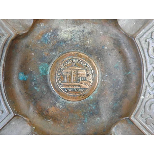 Vintage circa 1929 copper souvenir ashtray from Santa Catalina Island California. Medallion in center has relief of the...