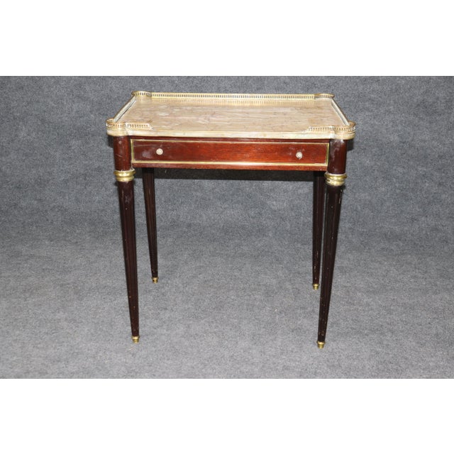 This is a superb French-made and signed "Made in France" Directoire style end or occasional table. The table does need...