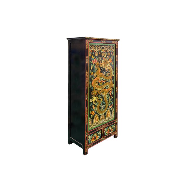Elevate your interior space with this magnificent, handcrafted Tibetan-style cabinet, a true masterpiece of vibrant...