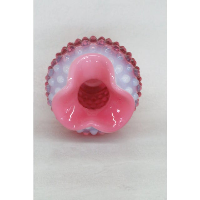 This lovely Vase is made of glass. This beautiful bud vase has brilliant vintage Fenton design; it features a classic...