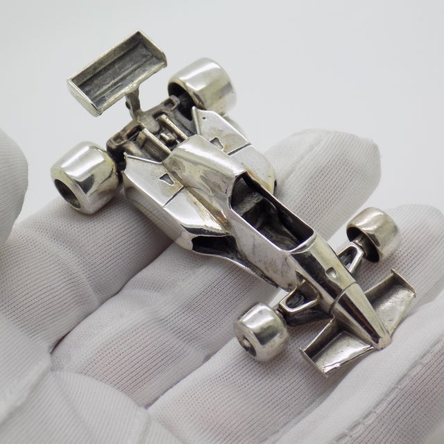 Striking vintage sculpture depicting a Ferrari 260 Formula 1 race car, handmade in Italy between the 1970s and 1980s in...