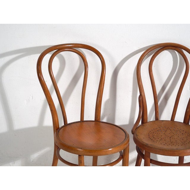 Antique Thonet Chairs (c.1920)Dimensions: Chair #1: Length: 41 cm Depth: 41 cm Height: 90 cm Seat: 47 cmChair #2: Length:...