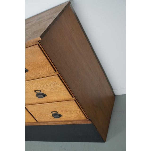 This haberdashery cabinet was produced during the 1950s in the netherlands my p mac lean. This piece features 18 large...