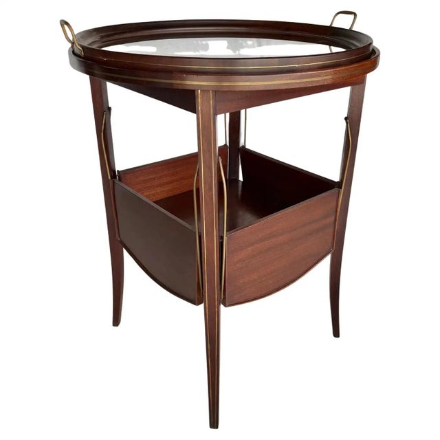 Found in the South of France, this Early 20th Century Tea Table was handcrafted in France from walnut and brass and dates...