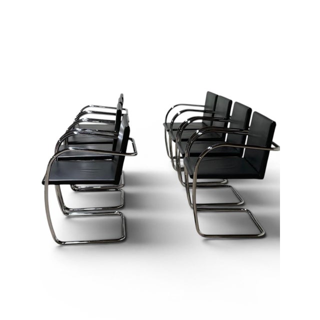 This is a set of eight Knoll Brno chairs, model 245A, initially designed by Mies van der Rohe in 1929. The chairs feature...