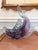 A dramatically sculptural Murano art glass fish caught mid-leap, rendered in deep amethyst and lavender sommerso glass...