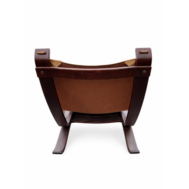Original Focus armchair with sling mechanism, manufactured by Bramin Møbler in the 1970s. Both armchairs have a seat...