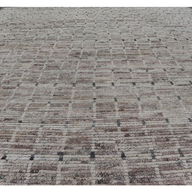 Measures:9'7 x 12. Neutral tone rug with free-flowing tribal design in shades of taupe, cream, and grays. Modern Moroccan...