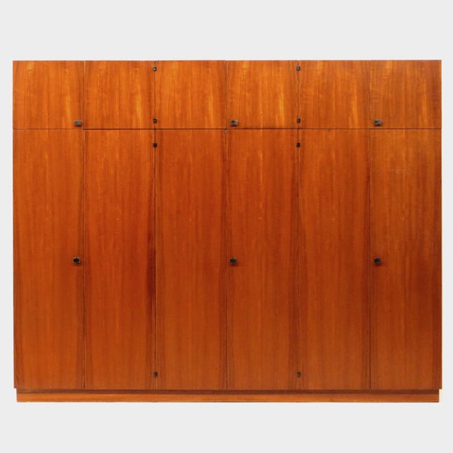 Large vintage mid century modern XL wardrobe in teak from the 1960s. This exclusive wardrobe features 12 cabinet doors...