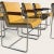A rare suite of eight AFKA guest armchairs by Krueger Metal Products, circa 1969-1970, pairing mustard vinyl upholstery...