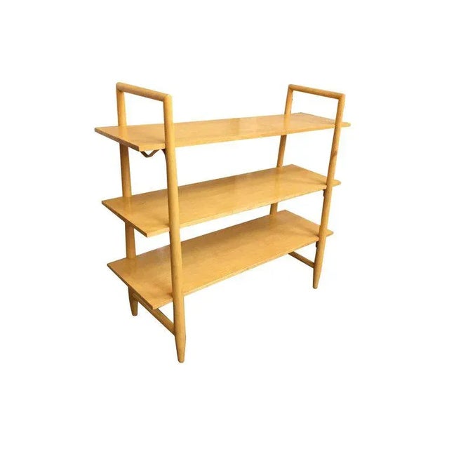 Swedish made blonde Mid-Century Modern bookshelf with three floating shelves designed by Edmond Spence for Walpole....