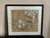 Vintage framed East Asian botanical painting featuring a blue songbird perched on a flowering branch with large white...