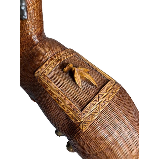 A striking and sculptural vintage moose figure handcrafted by Shanghai Handicrafts, featuring an intricately woven rattan...