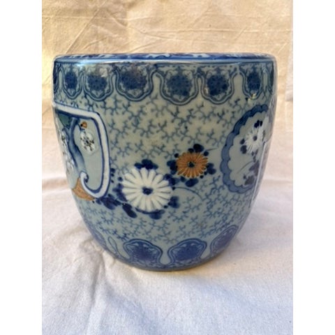 A single antique Japanese porcelain hibachi brazier or planter pot. The traditional blue and white decoration features...
