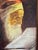 A mid-century oil on canvas depicting an elderly man reading. The painting is signed by the artist at lower left and...