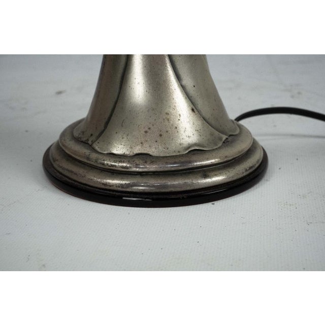 Elegant sculptural table lamp in 800 silver vermeil, depicting a graceful female figure gently embracing the light...