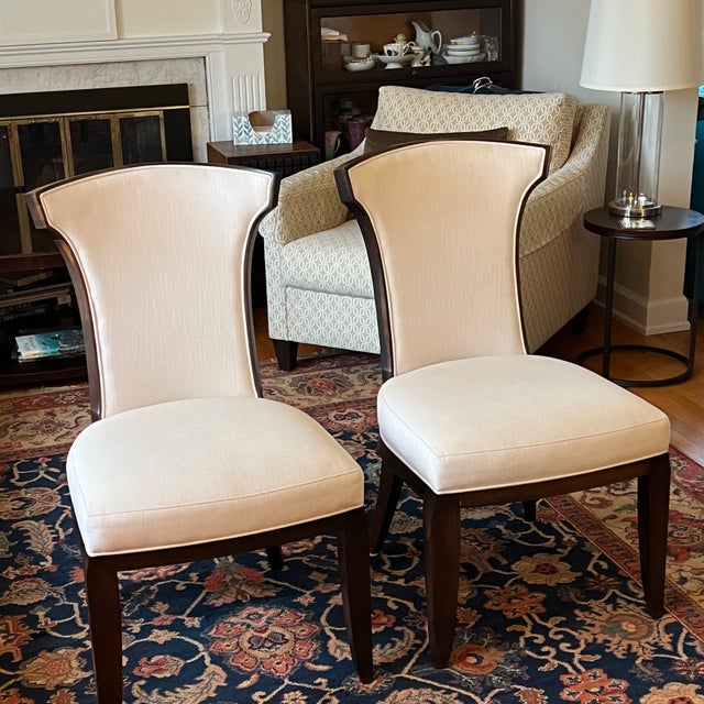 Available is a pair of "Elegance" side chairs from the Barbara Barry collection, realized by Henredon. Each chair features...