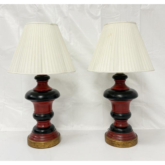 Striking pair of vintage ceramic table lamps designed and manufactured in the United States during the 1960s. With their...