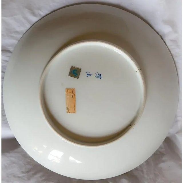 For sale is a Vintage Japanese Charger Wall Plate of Porcelain is Signed. It is 14" across and 2" high. There are 2 holes...
