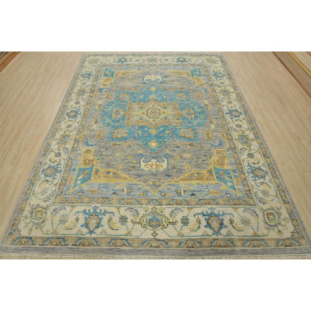 This traditional tribal Serapi rug is hand-knotted with an all-wool pile on a cotton foundation. This rug is new and in...