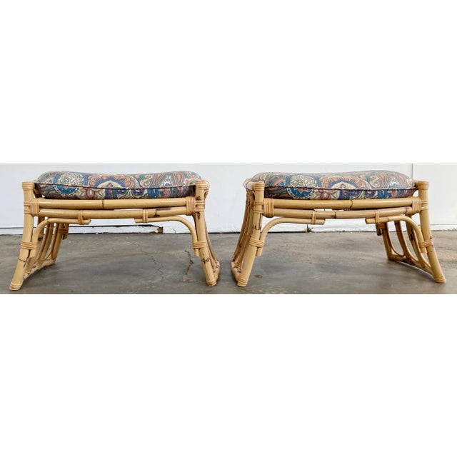 Pair of vintage Philippine rattan stools with custom cushion upholstery. Cushions free from base. Seat measures 14"H. Seat...