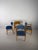 Set of four original chairs designed by Erik Buch, crafted from solid oak. The set consists of three armchairs – two...