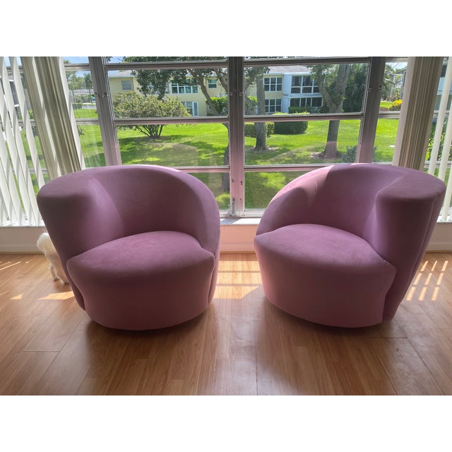 Pair of beautiful pink iconic Vladimir Kagen attributed Nautilus Swivel Chairs. Chairs are currently upholstered in the...