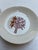 A matching pair of round porcelain butter plates from The Four Seasons restaurant in New York. Each plate features the...