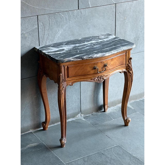 Elegant French bedside table in the Louis XV Revival style, dating from the early 20th century, circa 1910–1930. This...