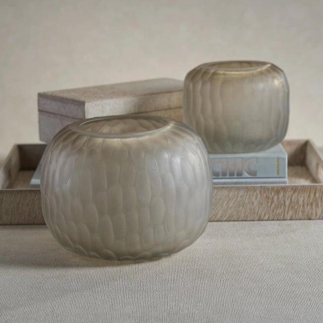 Curved forms with subtle honeycomb design create a warm and contemporary look with Albinen Glass Vase. The simple...