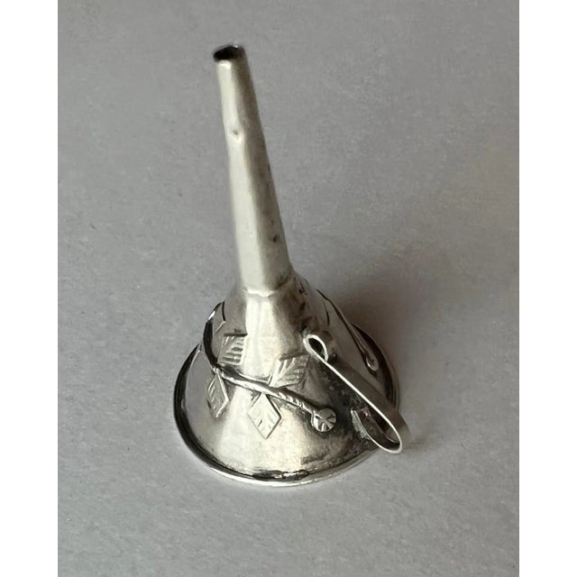 A lovely small funnel for perfume or putting liquid in small bottles. A decorative piece that could be hung around your...