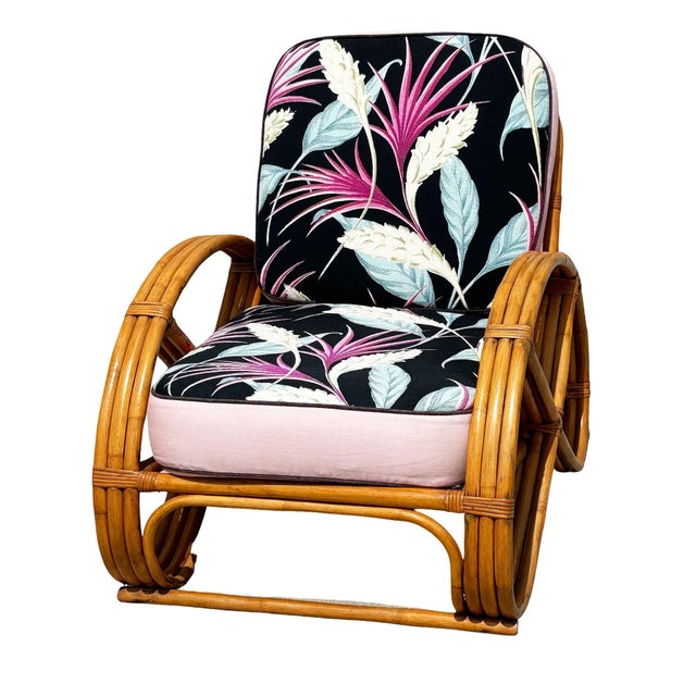 Beautifully restored rare 3-strand round full pretzel arm rattan lounge chair with fancy wicker wrappings. This design is...