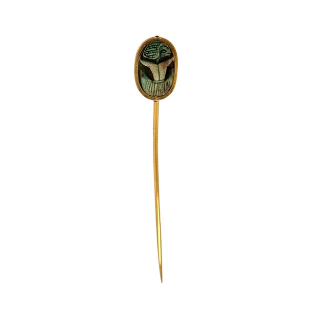 A fine and rare 19th century Egyptian Revival 14K gold stick pin, circa 1880. The scarab is figuratively carved on the...