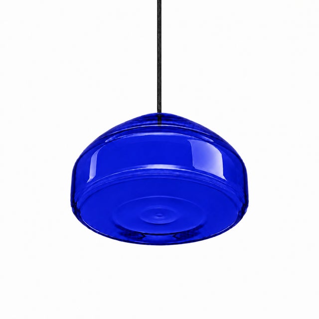 Crafted with high visual clarity, this modern pendant lamp features a sleek silhouette hand-blown from premium glass in a...