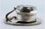 Metal Cup and Saucer in Plain Silver with Embossed Handle For Sale - Image 7 of 8